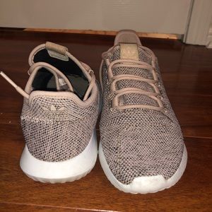 Blush women’s adidas athletic shoes.